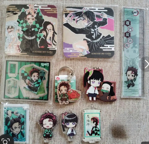 Tanjiro merchandise bundle: figure, acrylic stand, mini acrylic stand, keychain, Kanae, Tanjiro paper goods.