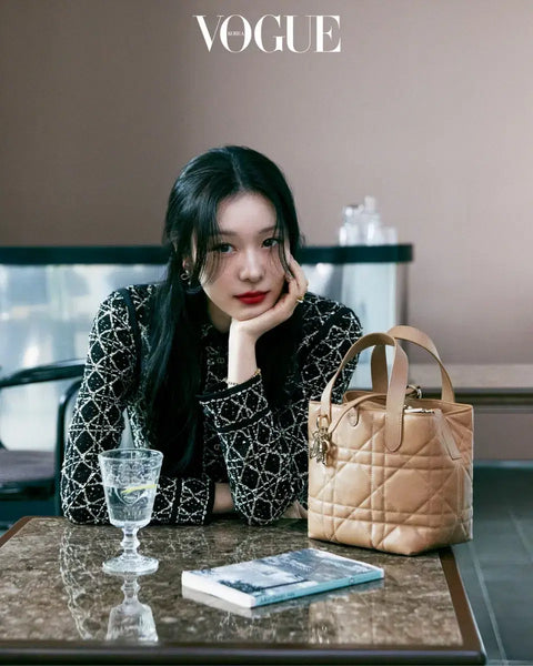 Transfer of Vogue magazine featuring New Jeans' Haerin and Kim Yuna's Dior photoshoot.