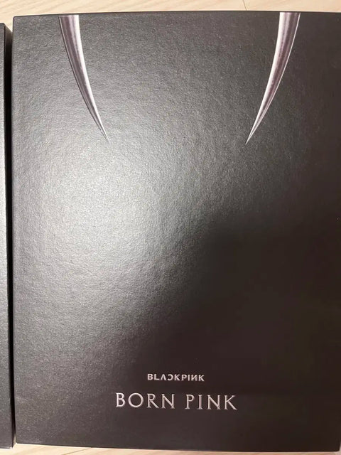 Blackpink photocards and opened albums, selling as a set.