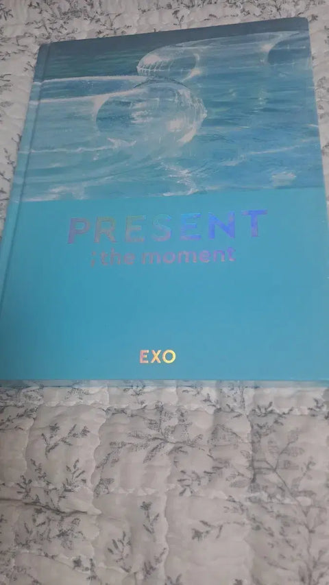 Selling EXO photobook, unopened.