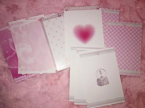 Selling pink binder pages.