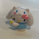 Hello Kitty figure wearing a Cinnamoroll hat