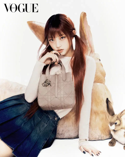 Transfer of Vogue magazine featuring New Jeans' Haerin and Kim Yuna's Dior photoshoot.