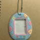 Selling ZB1 Colorgram special edition photo cards and Tamagotchi keychains.