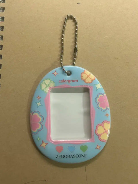 Selling ZB1 Colorgram special edition photo cards and Tamagotchi keychains.