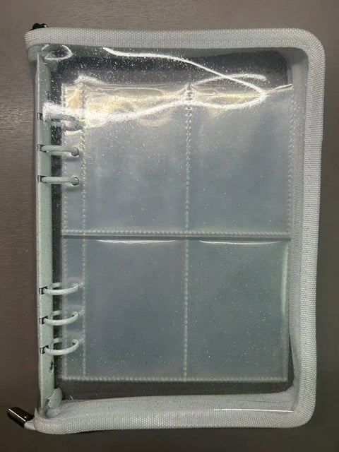 Selling white zipper binder.
