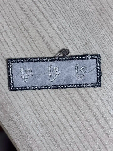 Kim Wonpil's name tag