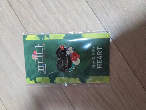 Selling "Frida" the Musical badge.
