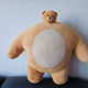 I'm selling a small-headed bear doll.