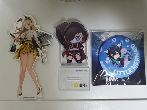 Nikke acrylic stands and can badges