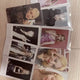 Blackpink photocards and opened albums, selling as a set.