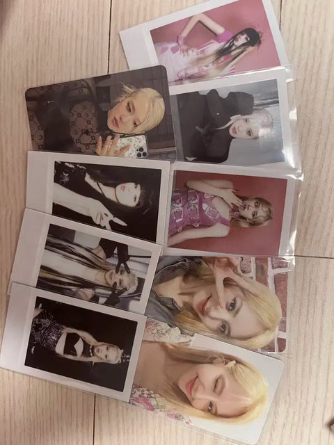 Blackpink photocards and opened albums, selling as a set.