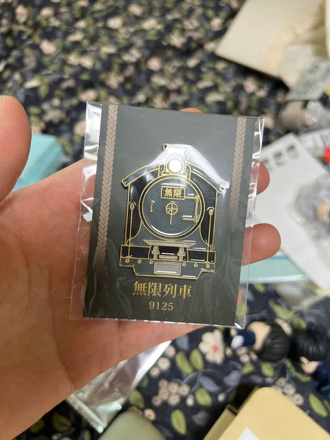 Selling Demon Slayer: Kimetsu no Yaiba Mugen Train unofficial pin badges.