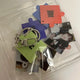 Boneca No Genre Music Core reverse support puzzle keyring transfer